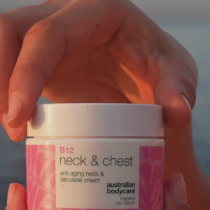Video of a model applying our Vitamin B12 Neck & Décolletage Cream, gently massaging it into her neck and chest area to show its smooth texture and firming effect.