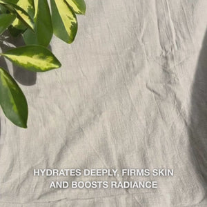 Close-up of a woman applying a bright pink Vitamin B12 Collagen face mask evenly to clean skin: she smooths the mask over cheeks, forehead, and chin, letting the moisturizing collagen and B12-infused formula hydrate and firm the skin for a soothing, radiant glow.